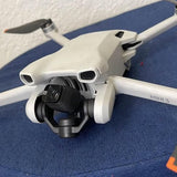 White drone with front camera gimbal and dual front sensors, Mini 3
