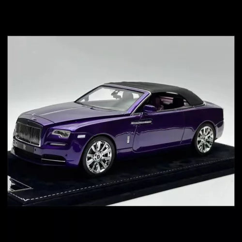 Purple 1:18 scale diecast car model with open grille and chrome wheels