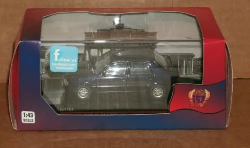 1:43 scale black diecast car model in clear display case, front view