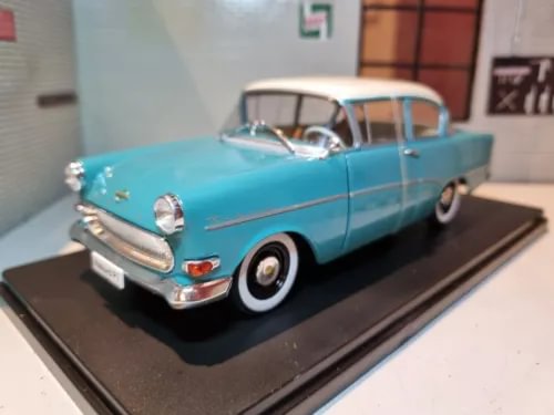 1:24 diecast model car, blue with white roof, front 3/4