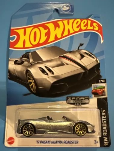 Silver and gray roadster diecast car with black wheels in retail blister pack