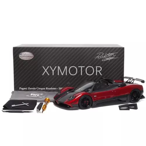 Diecast model car with red-and-black Pagani Zonda Cinque roadster and accessories