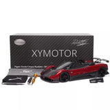 Diecast model car with red-and-black Pagani Zonda Cinque roadster and accessories
