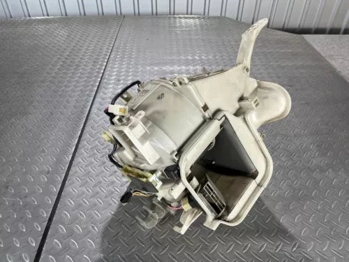 Diecast model car body with exposed interior parts in open frame