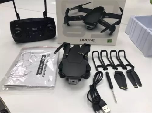 1080P FPV WiFi drone kit with controller, spare propellers, and charging cables