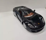 Black Porsche Carrera GT diecast toy car, 1:36 scale, front view