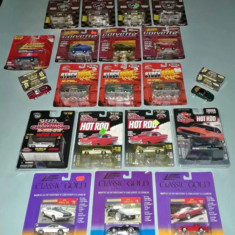 Set of 21 diecast cars in original blister packaging, assorted designs and colors
