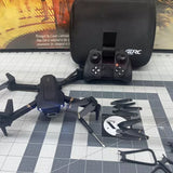 Black drone quadcopter with controller and soft carrying case