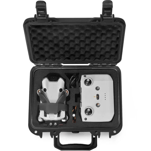 Black hard case with molded foam insert holding a compact drone and accessories.
