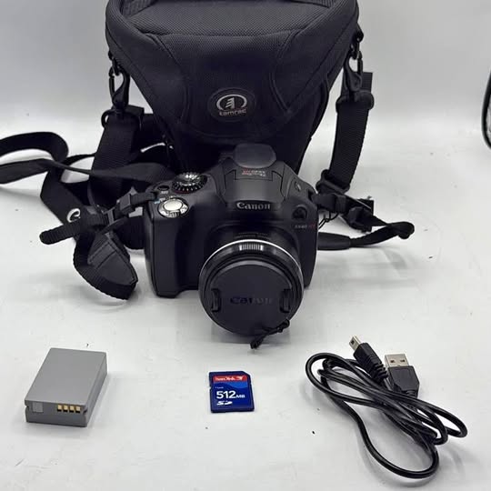 Canon PowerShot SX40 HS digital camera with carrying case, battery, memory card, cables