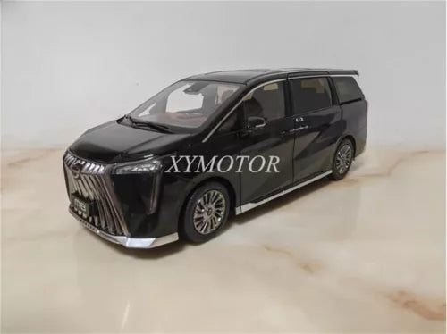 Black 1:18 diecast minivan model with front grille and headlights