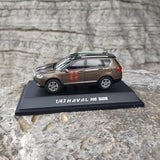 1:43 scale diecast SUV model car, brown, side view on display base