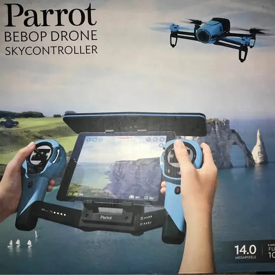 Blue quadcopter drone with handheld remote controller and screen