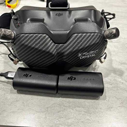 DJI Goggles V2 VR headset with black carbon-fiber faceplate and front controller module