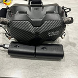 DJI Goggles V2 VR headset with black carbon-fiber faceplate and front controller module