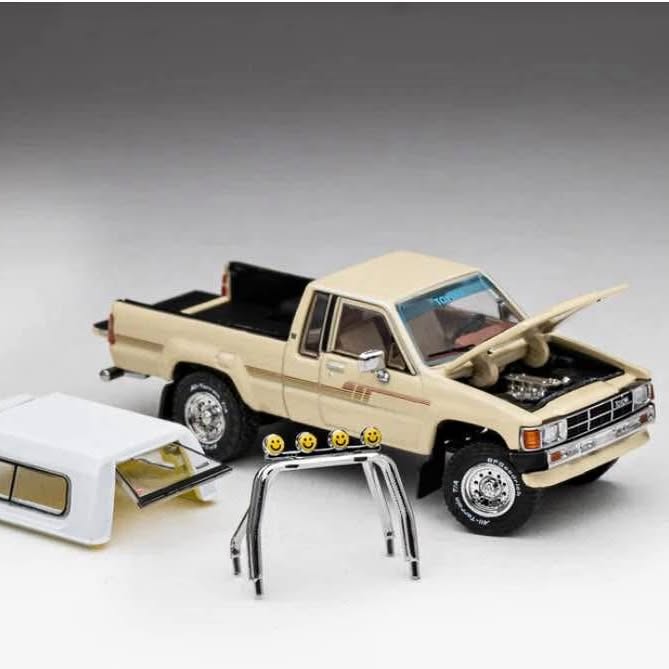 Beige diecast pickup truck model with open hood and black grille, 4x4 stance