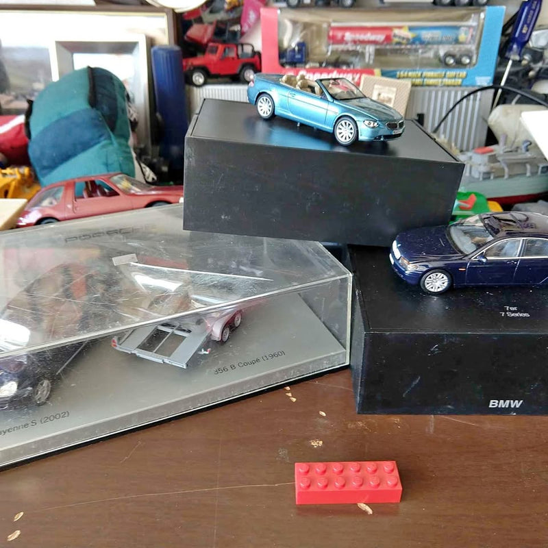 Diecast BMW promo dealer car models: blue and dark blue in open display boxes