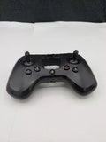 Black drone controller with dual joysticks, buttons, and top display