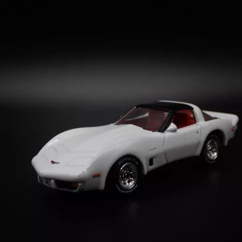 1:64 die-cast sports car model, white with red interior and black wheels