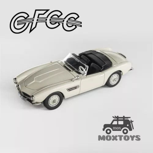 Convertible diecast model car, light gray with black interior, front 3/4 view
