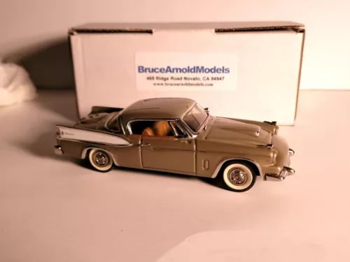Gold 1958 Packard Hawk diecast model car in open box