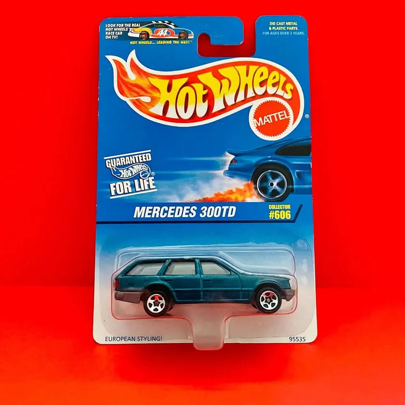 Hot Wheels die-cast Mercedes 300TD wagon car #606 on blister card