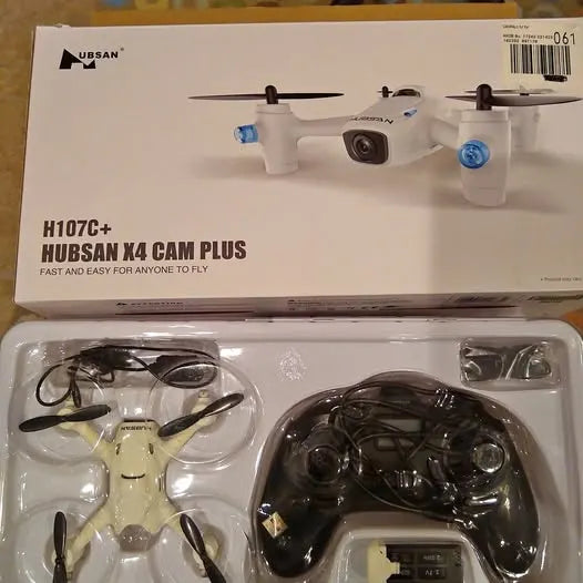 Toy quadcopter drone with camera, packaged in retail box