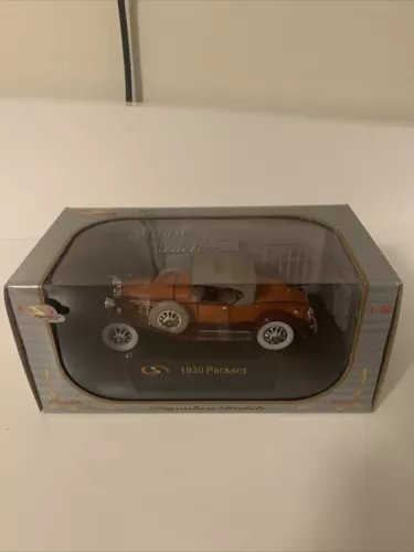 Orange diecast convertible model car in display box