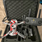 DJI Mini drone with propellers, shown in open protective case with foam insert