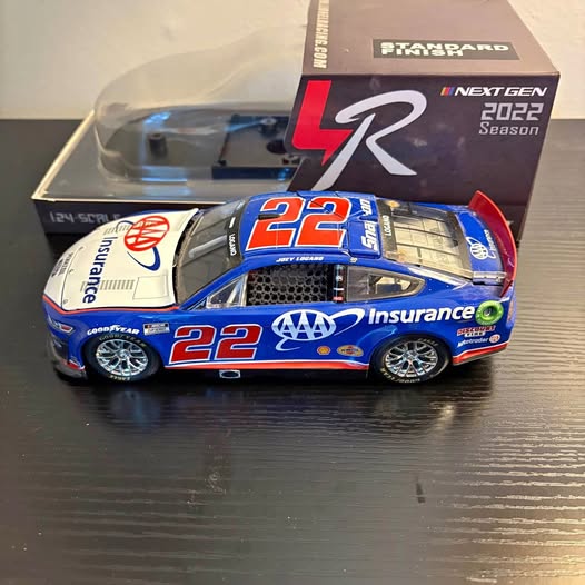 Blue #22 1:24 race car diecast with sponsor decals and black wheels