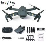Gray quadcopter drone with four propellers, remote controller, battery and accessory parts
