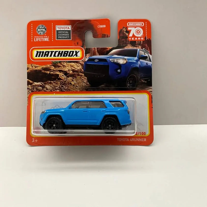 Blue Matchbox diecast Toyota 4Runner on short card, open blister package