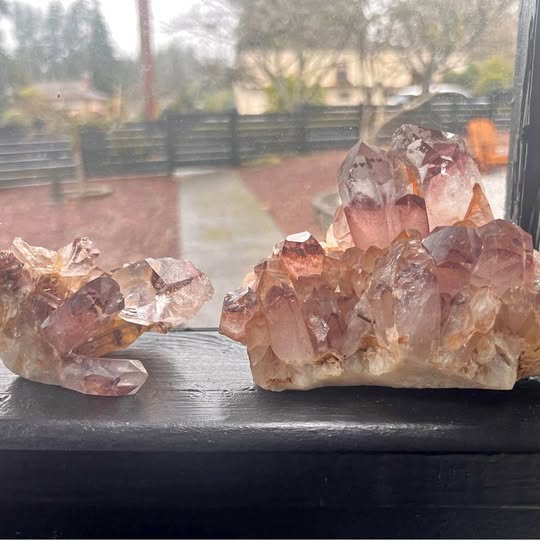 Red phantom quartz crystal cluster on dark base