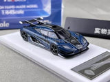 1:64 scale blue racing sports diecast car with black aero details, front three-quarter view