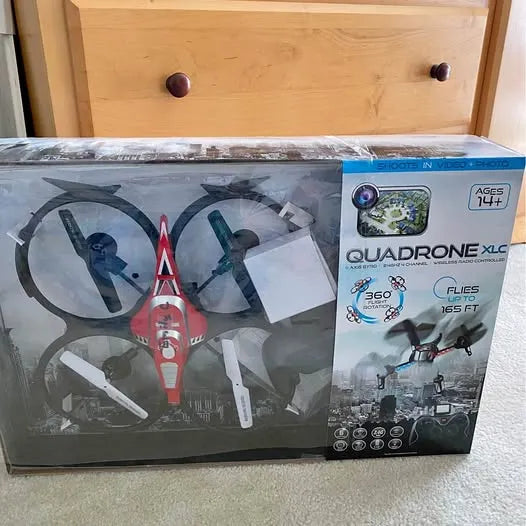 QuadRone XLC drone in retail box, quadcopter with controller accessories