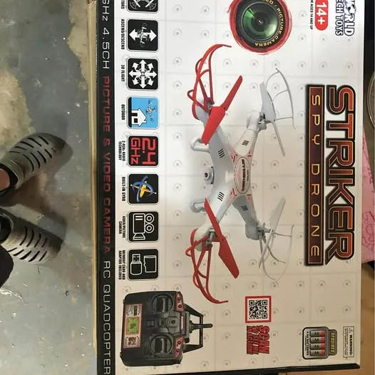Drone box packaging with foldable quadcopter diagram and controller illustration