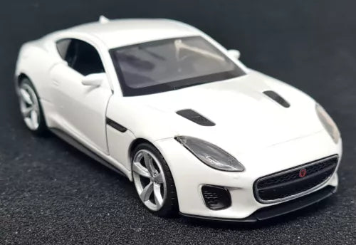 White diecast model car of a Jaguar F-Type with front 3/4 view