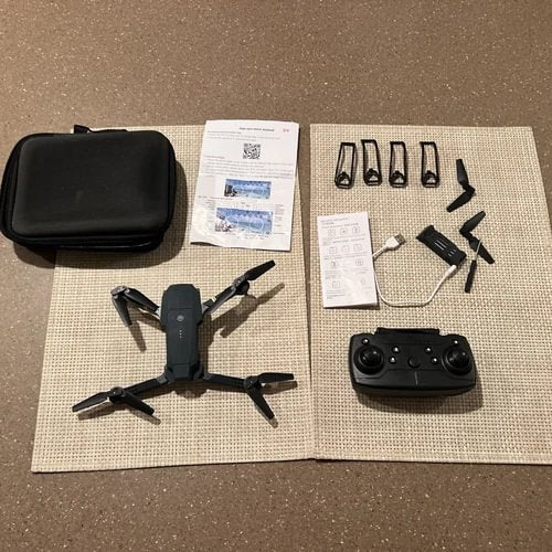 Foldable RC quadcopter drone with camera, remote controller, spare propellers and case