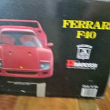 Red diecast toy truck in retail box, front view