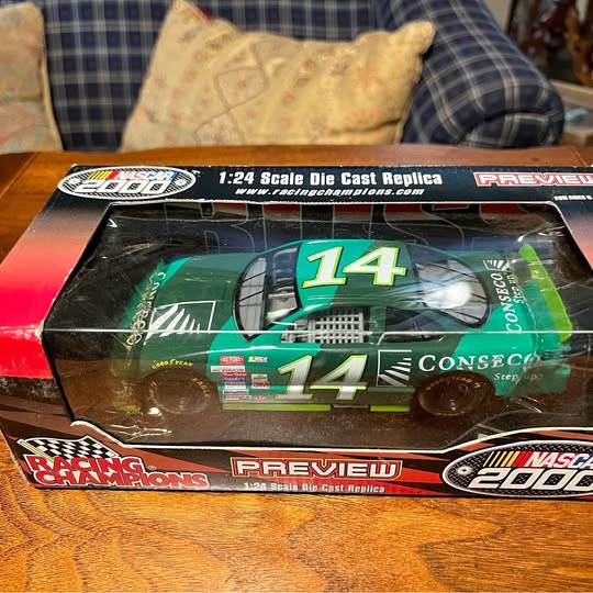 1:24 scale die-cast racing car replica in box, green #14
