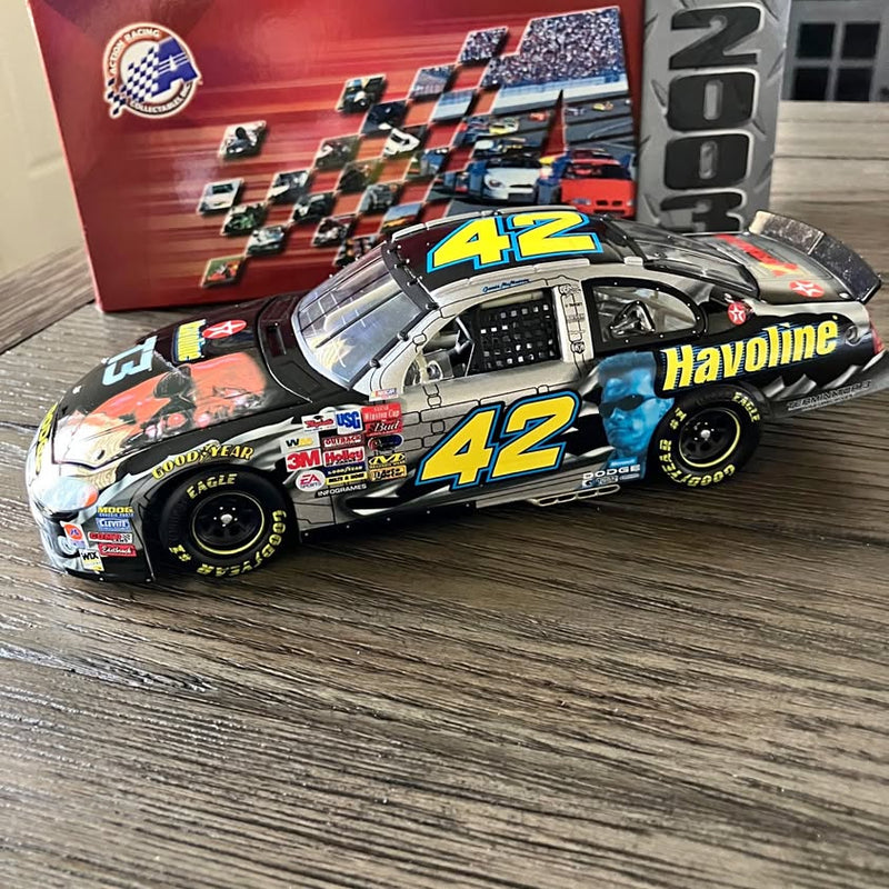 1:24 die-cast race car with #42 Havoline livery, orange and black, front three-quarter view