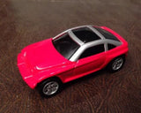 Red 1:64 metal diecast concept car with silver wheels and black windows