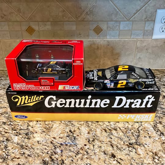 NASCAR diecast car set in red retail box with loose race car