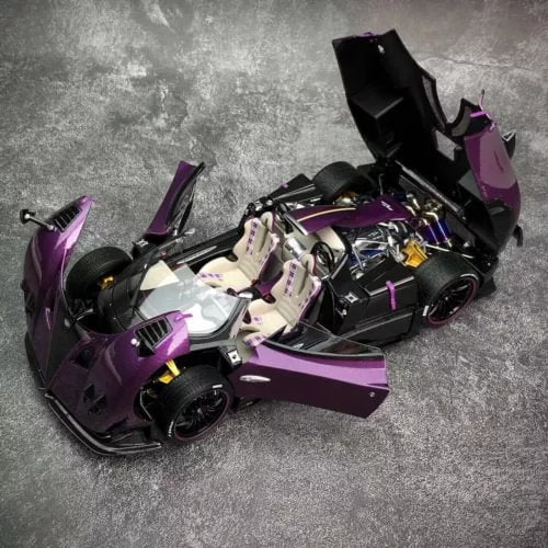 Purple and black 1/18 diecast open-top car model with rear hood open