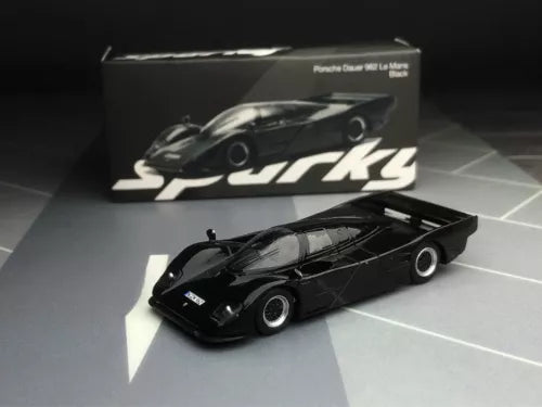 Sparky 1/64 black Porsche Dauer 962 diecast car model, side view with box