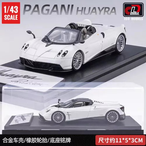 White diecast sports car model with open-top roadster body and detailed wheels