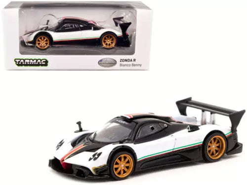 Diecast race car model in white and black, with gold wheels and rear wing