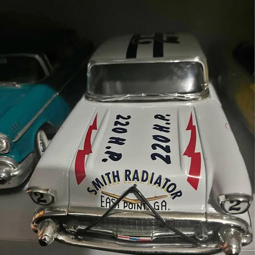 White diecast car front with grille, headlights, and racing number 22