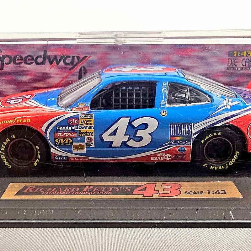 Blue 1:43 diecast race car model with number 43 on hood and front grille