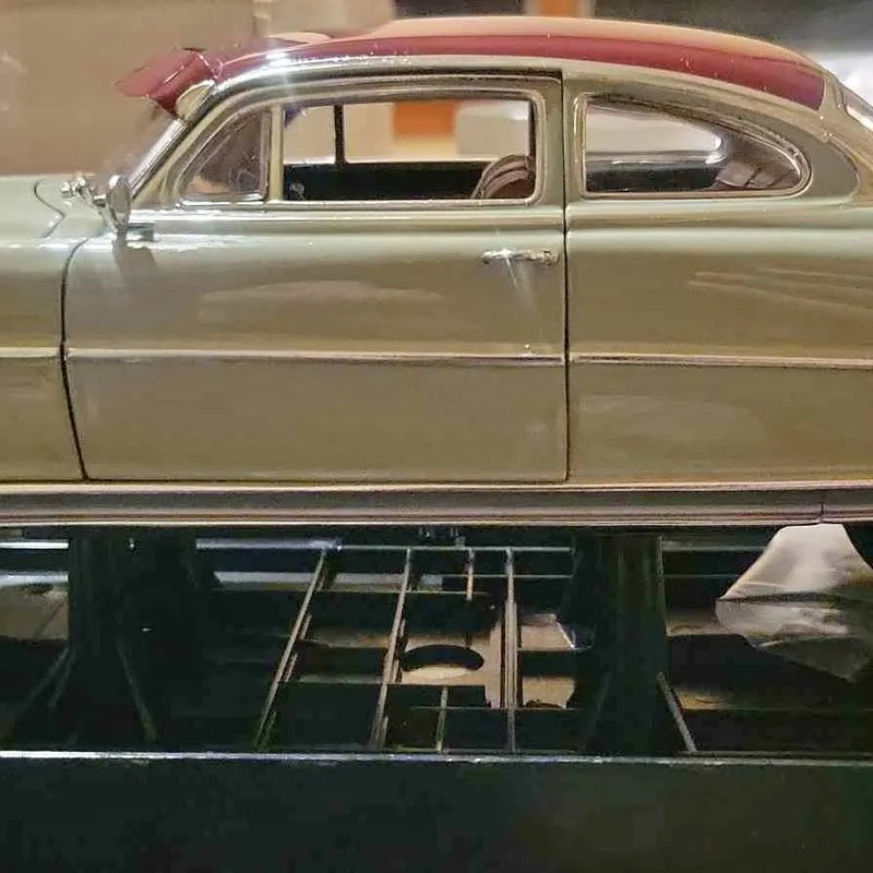 1/18 diecast model car, silver body with red roof, side view and doors